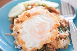Basil fried rice with pork and fried egg photo