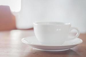 White coffee cup in a coffee shop photo