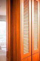 Wooden closet with a mirror partition photo