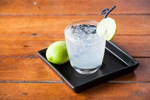 Iced water on a wood table photo