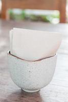 Tissue paper in a ceramic cup photo