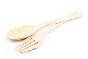 Wooden flatware on a white background photo