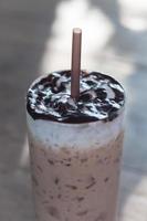 Iced coffee on a wooden table photo