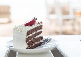 Vanilla and chocolate cake with strawberry photo