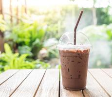 Iced chocolate coffee with nature background photo