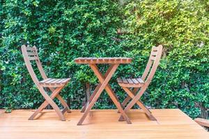 Empty wooden chairs and tables photo