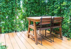 Empty wooden chairs and tables photo