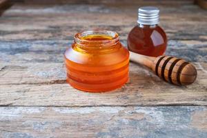 Organic honey on wooden table photo