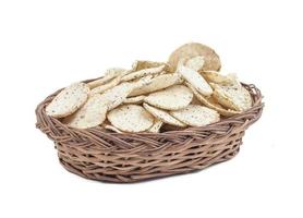 Oval wicker basket with chips in it photo