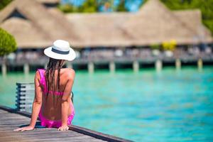 Maldives, South Asia, 2020 - Woman on a tropical beach jetty