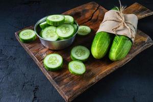 Sliced cucumbers on a cutting board photo