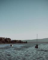 Two boats on sea during daytime photo