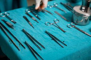 Surgical instruments on a table in operating room photo