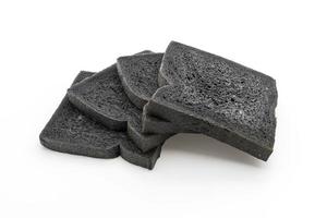 Charcoal bread on white background photo