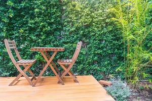 Empty wooden chairs and tables photo