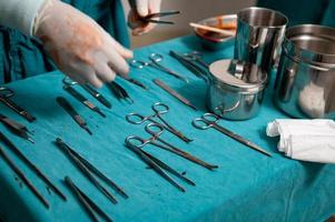 Surgical instruments on a table in operating room photo