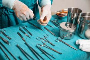 Surgical instruments on a table in operating room photo