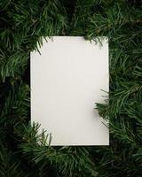 Creative layout made of leaves with paper card note photo