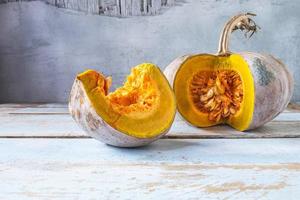 Pumpkin on a wooden table photo