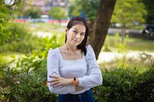 Beautiful asian woman age 40 years old with nature background outdoors photo