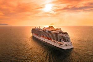 white ship on sea during sunset photo