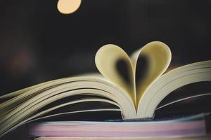 Curled paper in the shape of a heart with blurred bokeh photo