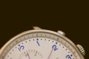 Close-up photo of gray chronograph watch