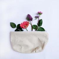 Flat lay of flowers in a bag photo