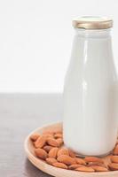 Bottle of almond milk and nuts photo