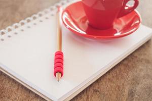 Notepad with a pencil and mug photo