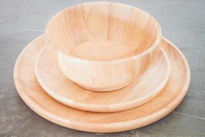 Wooden bowl and plates photo