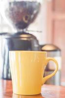 Yellow coffee mug with steam photo