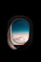 Window view of the world inside an airplane photo