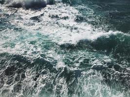 Aerial view of waves at mediterranean sea photo