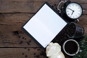 Wooden desk with coffee, top view photo