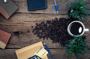 Wooden desk with notebook and coffee photo