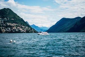 Lugano, Switzerland 2019-Passengers aboard the Morcote vessel in the glacial Lake Lugano photo