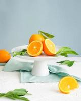 Oranges on a cake stand photo