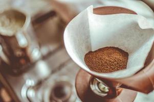 Brown coffee in a white strainer photo