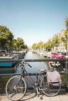 Amsterdam, Netherlands, 2020 - Bike parked on a bridge photo