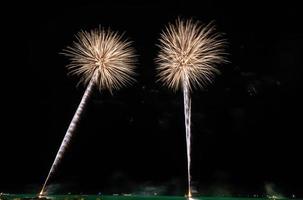 Gold fireworks in the night sky photo