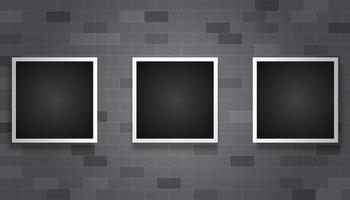 Dark picture frames hanging on gray brick background vector