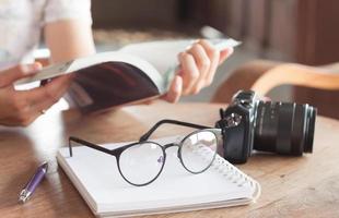 Woman reading book in a coffee shop photo