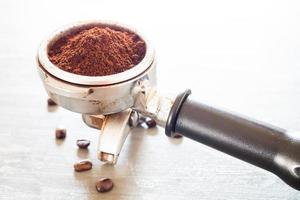 Coffee beans and a coffee grinder photo