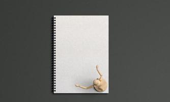 Small figure model with a notebook photo