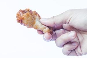Hand holding a drumstick photo