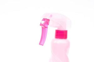 Pink spray bottle on a white background photo