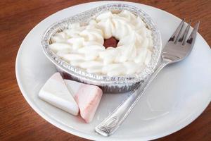 Close-up of a cheesecake on a wood background photo