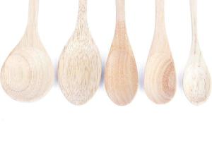 Wooden spoons isolated on a white background photo