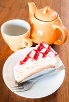 Tea break with a white chocolate and cherry cake photo